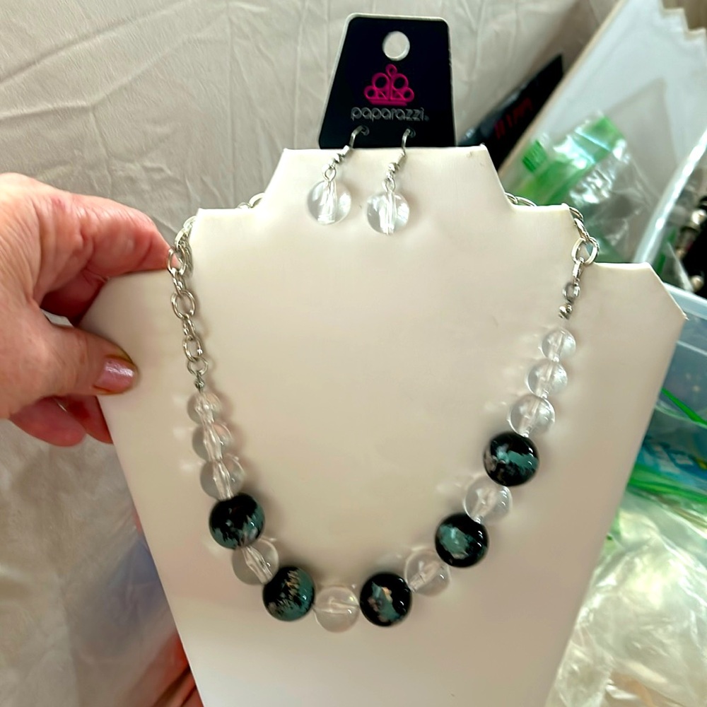 Black and turquoise with a hint of gold bead with clear beads also necklace